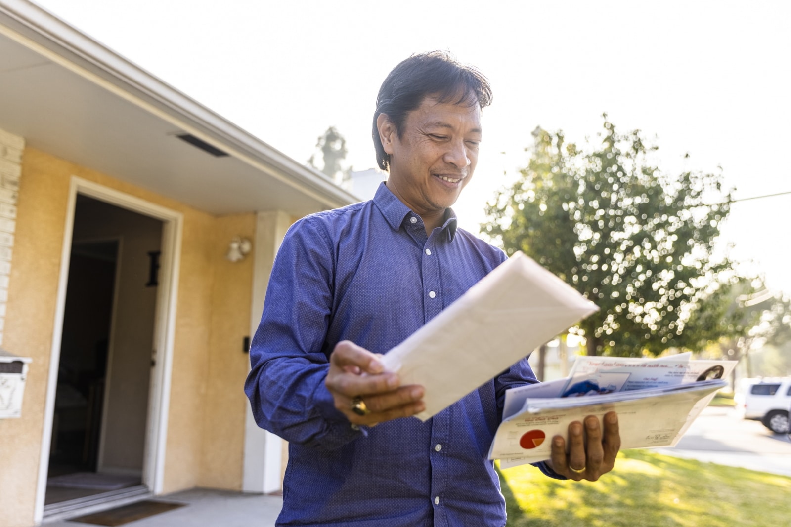 direct mail campaigns trending mature man checking the mail