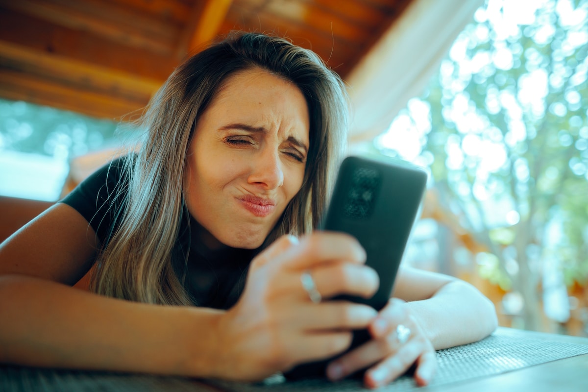 print marketing woman squinting phone digital fatigue