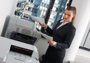 business woman at office printer